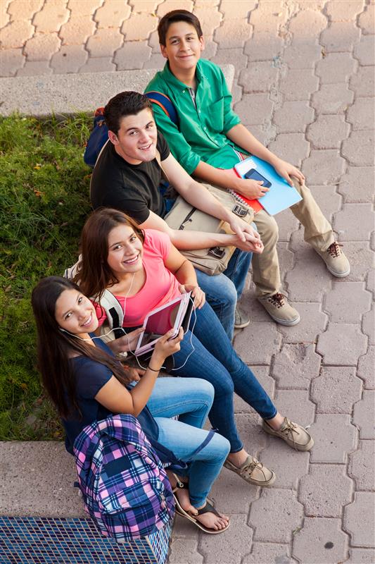 high angle view group high school friends hanging out after class