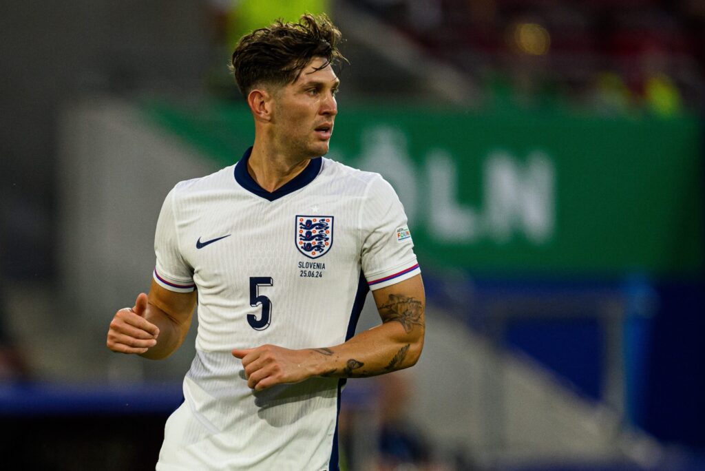 Learning English Through Football in Thailand: How Our Premier Skills Programme Makes It Real 1 England footballer in action during an international match, illustrating how students can learn English through football in Thailand and study English in Hua Hin.