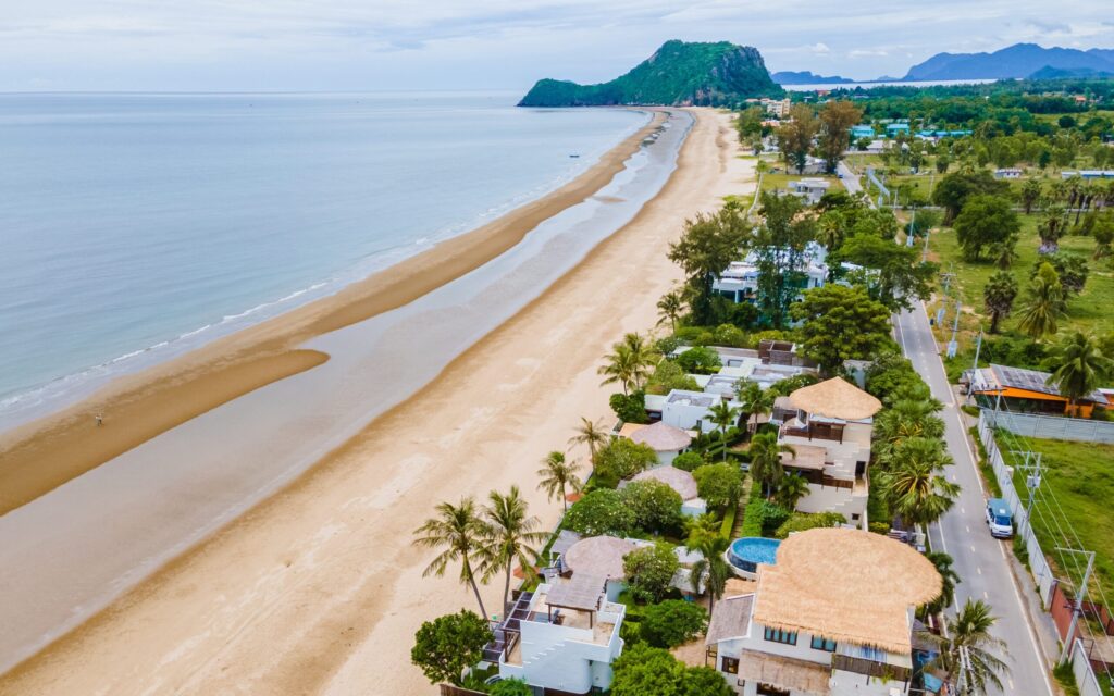 Dragon Student Life Channel 89 On-site English learning in Hua Hin with a peaceful empty beach and mountain view near schools and residences.
